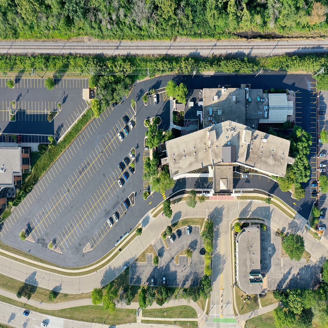 Huge commercial parking lot freshly stiped and seal coated