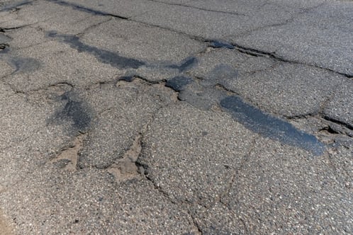 asphalt pavement with damage and cracks