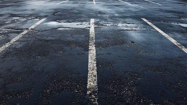 damaged asphalt parking spots in lot