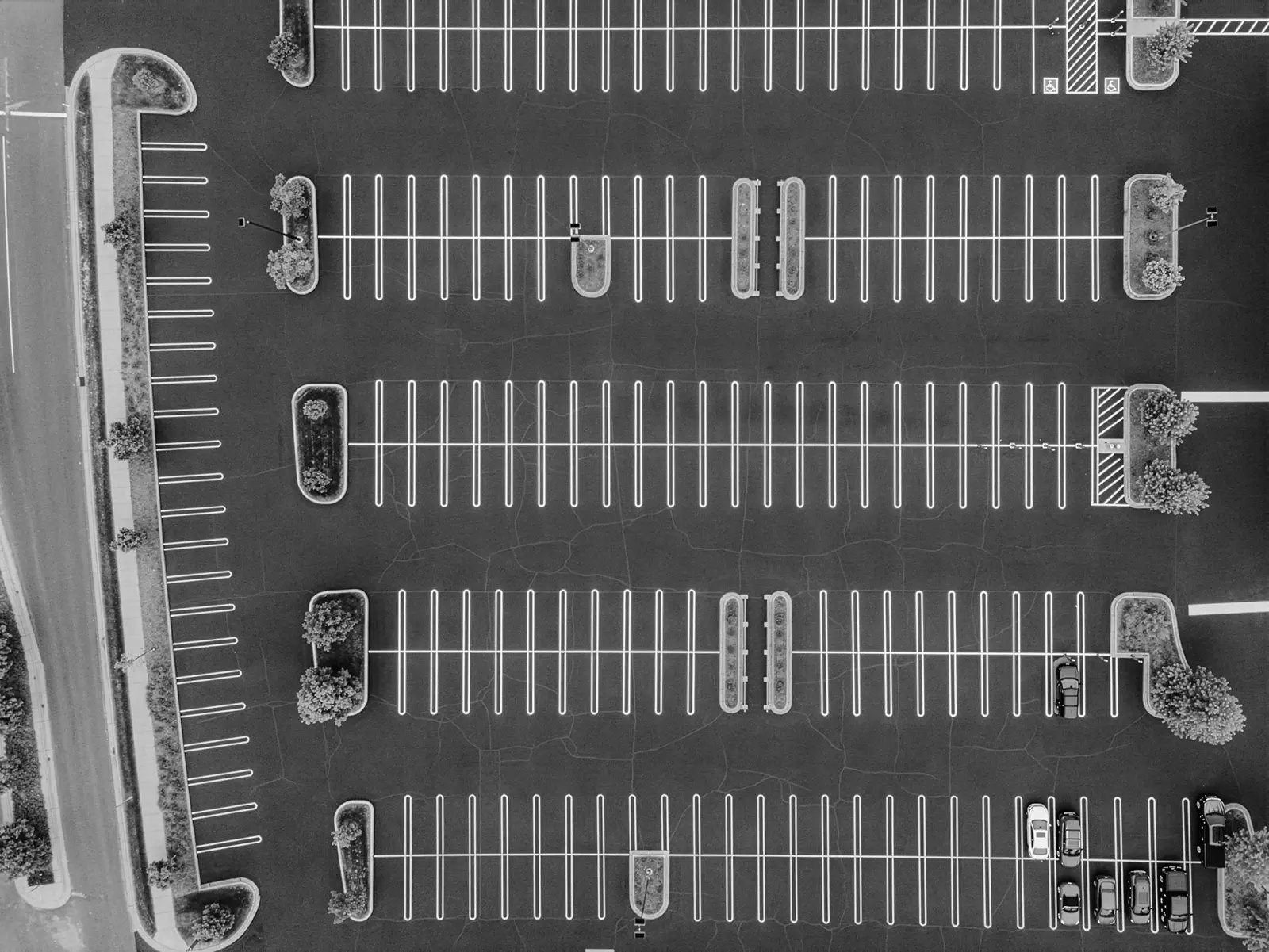 Aerial view of freshly striped commercial parking lot with crisp white parking lines