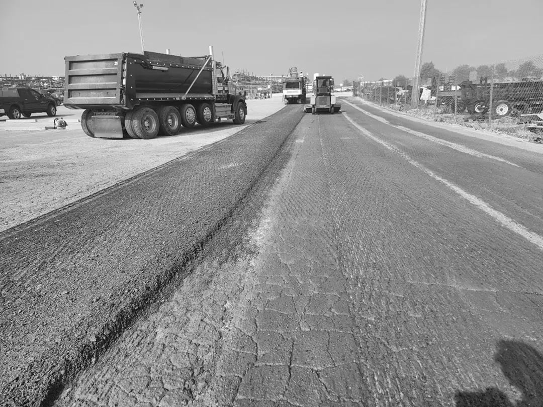 Doctor Asphalt milling machine removing old pavement during mill-and-overlay road resurfacing