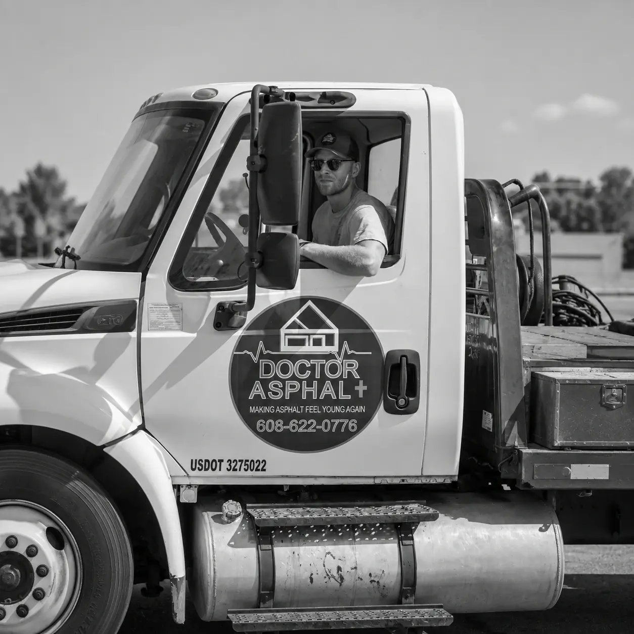 Man in a Doctor Asphalt truck